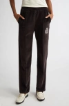 Sporty And Rich Sporty & Rich Crest Velour Track Pants In Chocolate