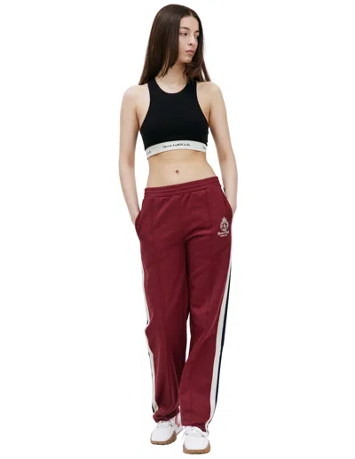 Sporty And Rich Crown Track Pants In Burgundy