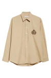 Sporty And Rich Sporty & Rich Embroidered Crest Oversize Cotton Poplin Button-up Shirt In Light Tan
