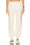 Sporty And Rich Sporty & Rich Health & Wellness Graphic Sweatpants In Cream