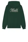 Sporty And Rich Health Script Hoodie In Forest