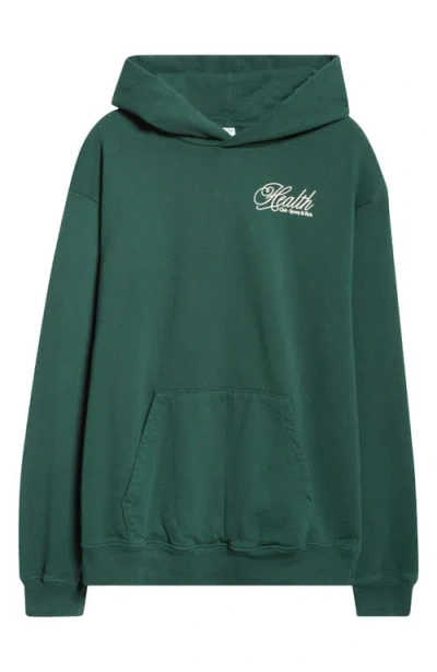 Sporty And Rich Sporty & Rich Health Script Oversize Cotton Fleece Graphic Hoodie In Forest