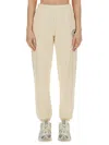 Sporty And Rich + Prince Net Printed Cotton-jersey Track Pants In Beige