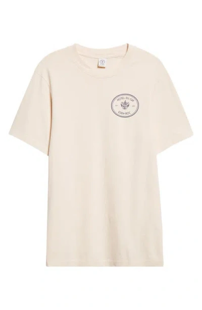 Sporty And Rich Sporty & Rich Kennedy Crest Cotton Graphic T-shirt In Brown