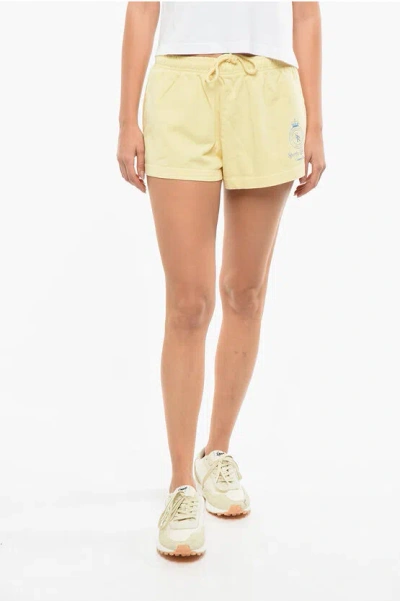 Sporty And Rich Logo Printed Solid Color Shorts In Yellow