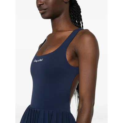 Sporty And Rich Logo-print Pleated Performance Dress In Animal Print