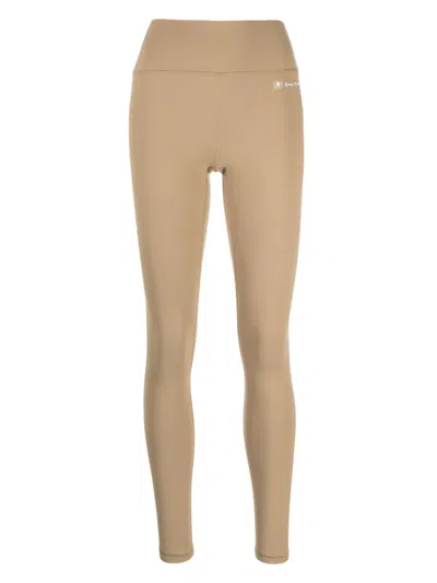 Sporty And Rich Runner Script Logo-embossed Leggings In Brown