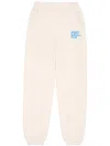 Sporty And Rich Slogan-print Cotton Track Pants In Cream