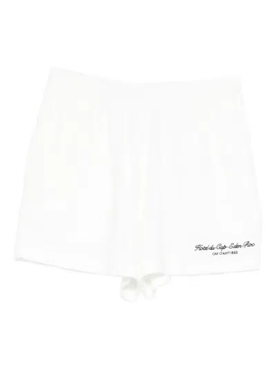 Sporty And Rich X Hotel Du Cap Eden Roc Eden Script Embroidered Mini Shorts In White