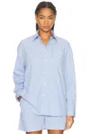Sporty And Rich X Hotel Du Cap Eden Roc Eden Script Oversized Shirt In Blue