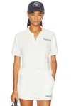 Sporty And Rich X Hotel Du Cap Eden Roc Eden Script Terry Polo Top In White