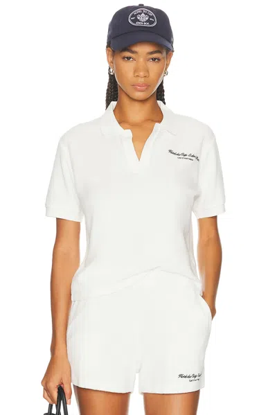 SPORTY AND RICH X HOTEL DU CAP EDEN ROC EDEN SCRIPT TERRY POLO TOP