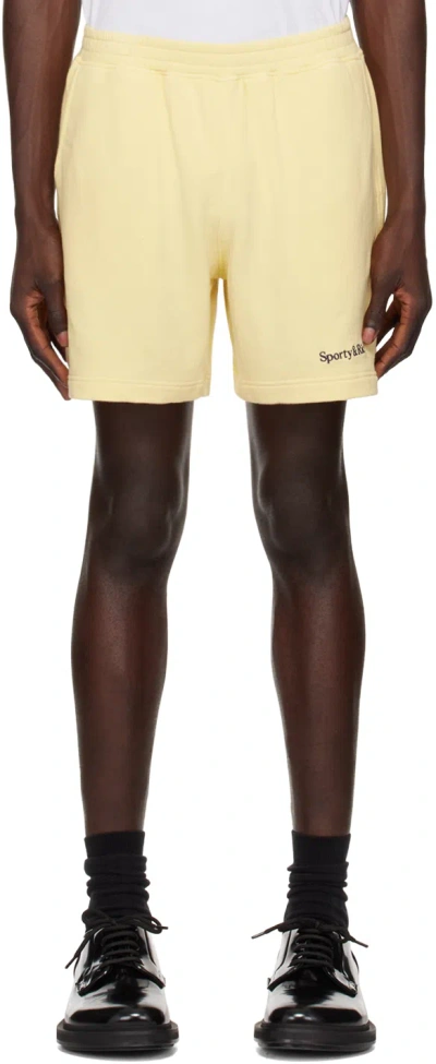 Sporty And Rich Yellow Serif Logo Gym Shorts In Almond