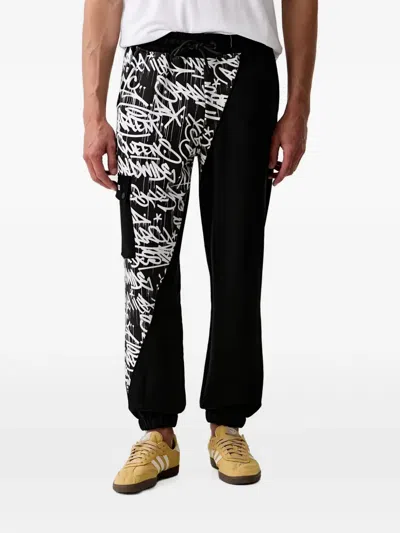 Sprayground Graffiti-print Cargo-pocket Track Pants In Black