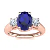 SSELECTS 1 1/5 CARAT OVAL SHAPE SAPPHIRE AND TWO DIAMOND RING IN 14 KARAT ROSE GOLD