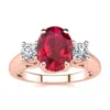 SSELECTS 1 3/4 CARAT OVAL SHAPE RUBY AND TWO DIAMOND RING IN 14 KARAT ROSE GOLD