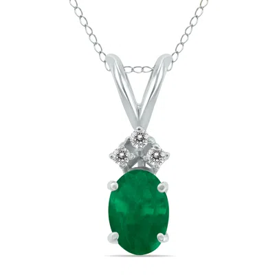 Sselects 14k 6x4mm Oval Emerald And Three Stone Diamond Pendant In Green