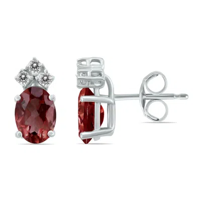Sselects 14k 6x4mm Oval Garnet And Three Stone Diamond Earrings In Red