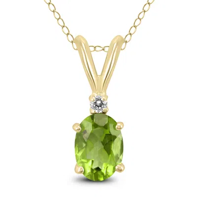 Sselects 14k 6x4mm Oval Peridot And Diamond Pendant In Green
