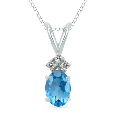 Sselects 14k 6x4mm Oval Topaz And Three Stone Diamond Pendant In Blue
