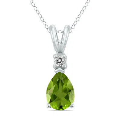 Sselects 14k 6x4mm Pear Peridot And Diamond Pendant In Green