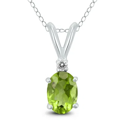 Sselects 14k 7x5mm Oval Peridot And Diamond Pendant In Green