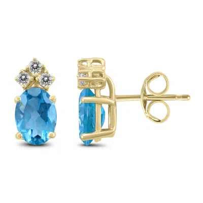 Sselects 14k 7x5mm Oval Topaz And Three Stone Diamond Earrings In Blue