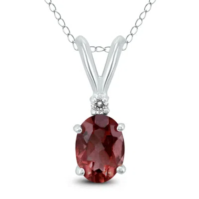 Sselects 14k 8x6mm Oval Garnet And Diamond Pendant In Red