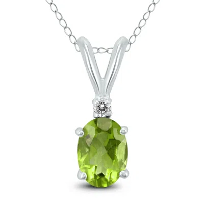 Sselects 14k 8x6mm Oval Peridot And Diamond Pendant In Green