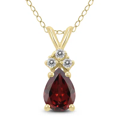Sselects 14k 8x6mm Pear Garnet And Three Stone Diamond Pendant In Red