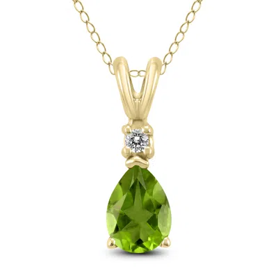 Sselects 14k 8x6mm Pear Peridot And Diamond Pendant In Green