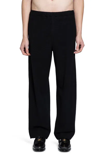 Ssstein Trousers In Black