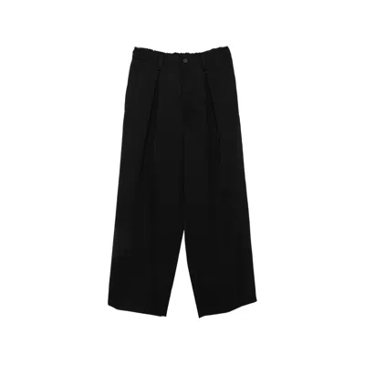 Ssstein Trousers In Black