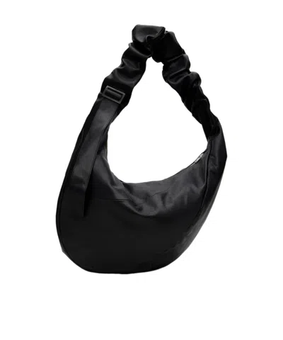 Ssstein Twist Shoulder Bag In Black
