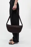 St Agni Lattice Weave Crescent Bag In Port