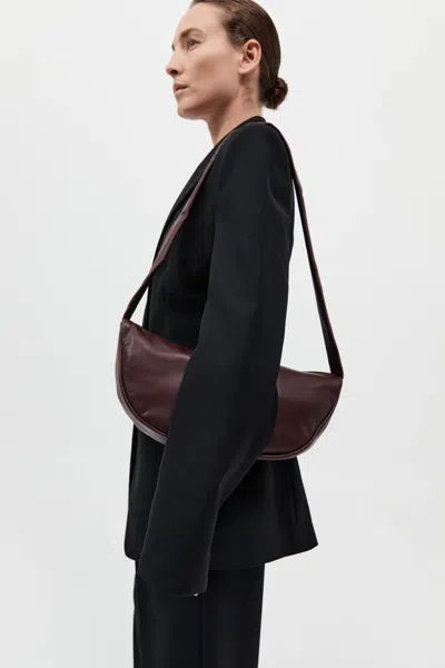St Agni Soft Crescent Bag In Plum