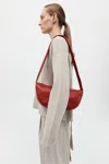 St Agni Soft Crescent Bag In Rosso