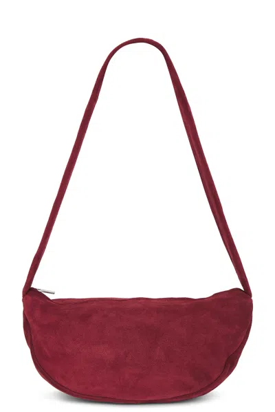 St Agni Soft Crescent Bag In Rouge