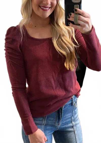 Staccato Puffed Cinched Sleeve Long Sleeve Top In Burgundy In Red