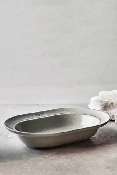 STAUB CERAMIC DINNERWARE 10-INCH OVAL STONEWARE SERVING DISH IN WHITE TRUFFLE AT URBAN OUTFITTERS