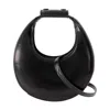 Staud Crescent Moon-shaped Mini Bag In Polished Black Leather In Black