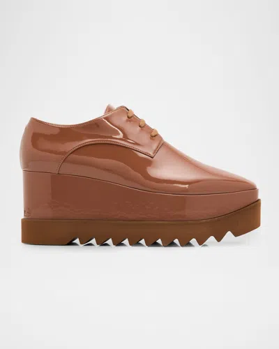 Stella Mccartney Elyse Shiny Patent Wedge Sneakers In Brown