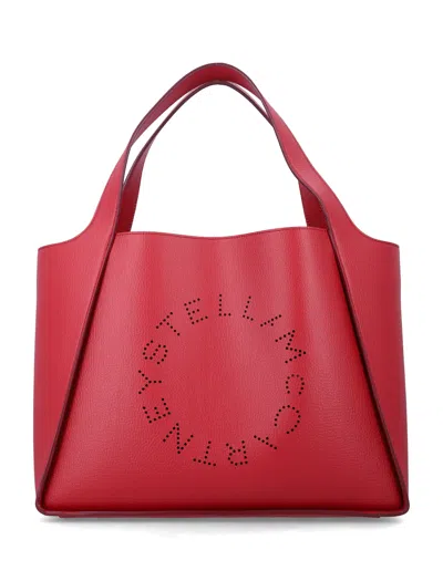 Stella Mccartney Logo Studded Vegan Leather Tote Handbag In Red