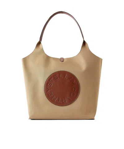 Stella Mccartney Logo-embossed Reversible Vegetarian Leather And Cotton-twill Tote In Brown