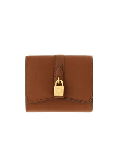 Stella Mccartney Ryder Padlock Tri-fold Wallet In Brown