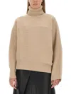 Stella Mccartney Textured Knit Oversized Turtleneck Shirt In Neutral