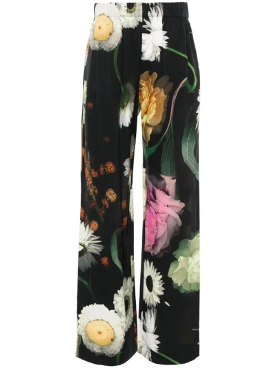 Stine Goya Floral-print Trousers In Black