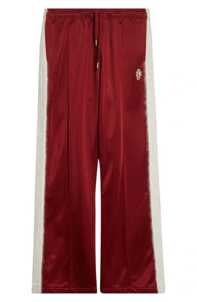Stockholm Surfboard Club Monogram Track Pants In Red