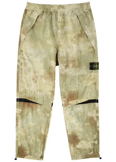 Stone Island Camouflage-print Shell Trousers In Green