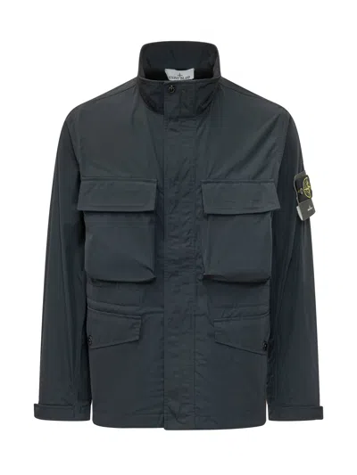 Stone Island Elevated Jacket With Front Pockets And High Neck In Blue